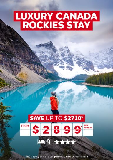 Luxury Canada Rockies stay - save up to $2710* | from $2,899* per person | *T&Cs apply. Price is per person, based on twin share | Woman staring at a clear, blue lake in Canada