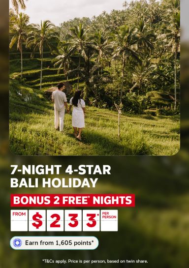 Couple walking hand in hand through lush Bali rice terraces for a 7-night 4-star holiday with 2 bonus free nights from $233 per person