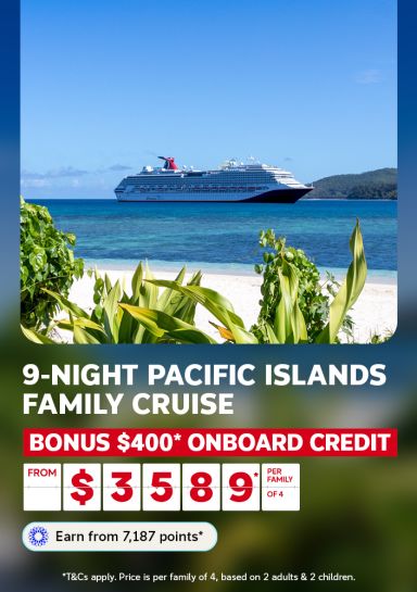 Cruise ship anchored off a tropical Pacific Island beach framed by lush greenery for a 9-night family cruise with bonus $400 onboard credit from $3589 per family