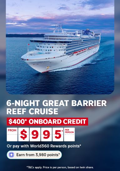 Cruise ship sailing calm waters at dusk for a 6-night Great Barrier Reef cruise with $400 onboard credit from $995 per person