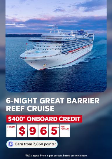 Cruise ship sailing at dusk toward the Great Barrier Reef for a 6-night cruise with $400 onboard credit from $965 per person
