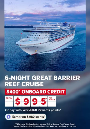Cruise ship sailing at dusk on calm waters for a 6 night Great Barrier Reef cruise with 400 dollars onboard credit from 995 per person