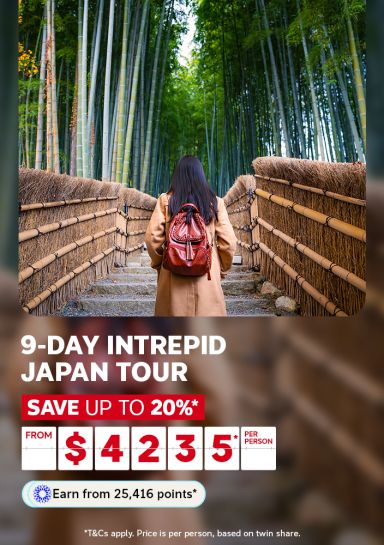 Woman with red backpack walking through Arashiyama bamboo forest for a 9 day Intrepid Japan tour saving up to 20% from $4235 per person