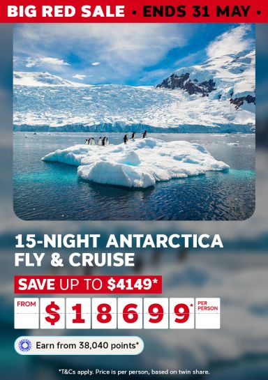 enguins on a floating iceberg in icy blue Antarctic waters for a Big Red Sale 15-night fly and cruise saving up to $4149 from $18699 per person