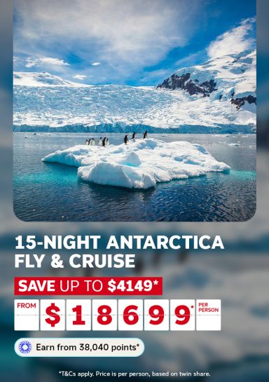 Penguins standing on a floating iceberg in icy Antarctic waters for a 15-night fly and cruise saving up to $4149 from $18699 per person