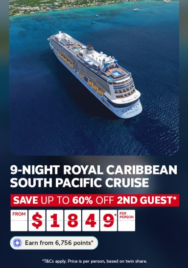 Royal Caribbean cruise ship sailing towards an island featuring a 9-night South Pacific cruise from $1,849*