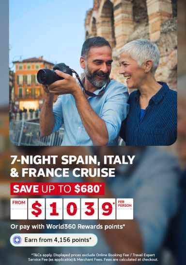 Man photographing his partner near ancient ruins at dusk for a 7 night Spain Italy and France cruise saving up to 680 dollars from 1039 per person