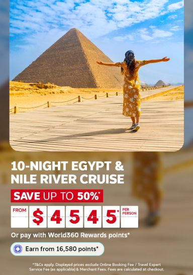 Woman with arms outstretched before the Great Pyramids of Giza for a 10-night Egypt and Nile River cruise saving up to 50% from 4545 per person