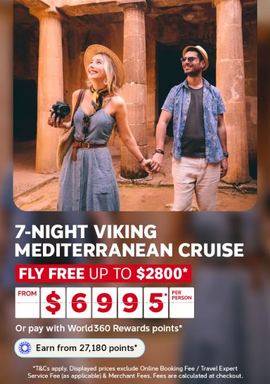 Couple exploring ancient stone columns hand in hand for a 7-night Viking Mediterranean cruise with fly free up to 2800 from 6995 per person