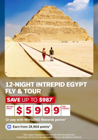  Couple walking toward the Step Pyramid of Saqqara for a 12-night Intrepid Egypt fly and tour saving up to 987 from 5999 per person