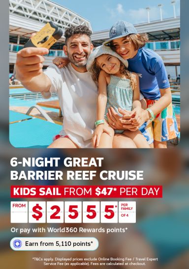 Smiling family taking a selfie by a cruise ship pool on a sunny deck for a 6 night Great Barrier Reef cruise where kids sail from $47 per day and family of 4 from $2555
