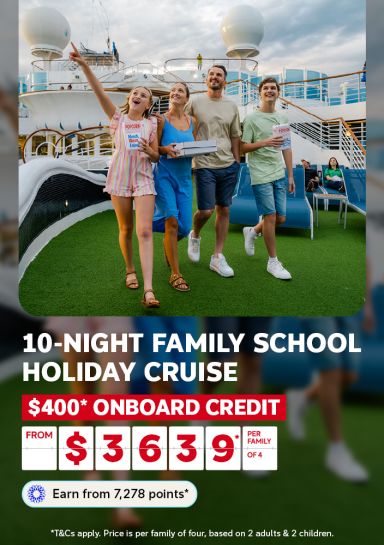 Family with popcorn strolling the deck of a cruise ship for a 10-night family school holiday cruise with $400 onboard credit from $3639 per family of 4