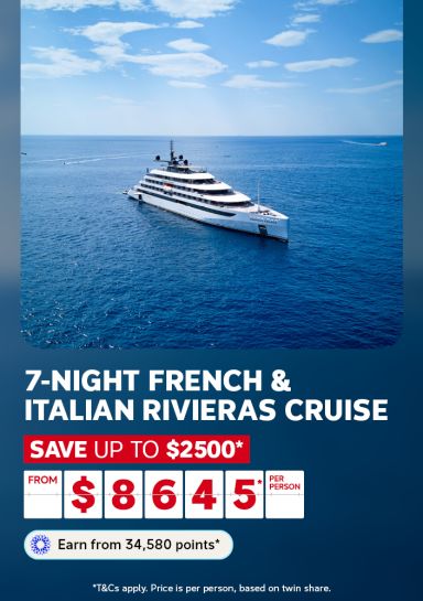 Luxury cruise ship sailing calm blue waters for a 7-night French and Italian Rivieras cruise saving up to $2500 from $8645 per person