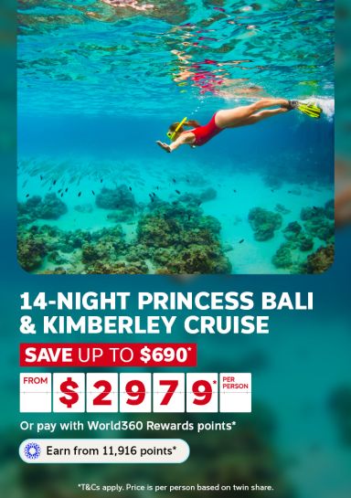 Woman snorkeling over a coral reef in turquoise water for a 14-night Princess Bali and Kimberley cruise saving up to $690 from $2979 per person