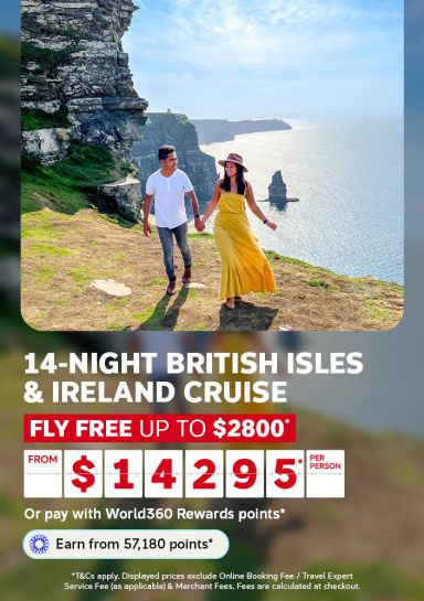 Couple holding hands on dramatic coastal cliffs for a 14 night British Isles and Ireland cruise flying free up to 2800 dollars from 14295 per person