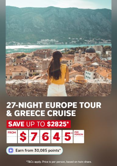 Person gazing over terracotta rooftops and a mountain bay for a 27-night Europe tour and Greece cruise saving up to $2825 from $7645 per person
