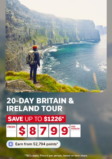 Hiker with a backpack overlooking dramatic coastal cliffs in Ireland for a 20-day Britain and Ireland tour saving up to $1226 from $8799 per person