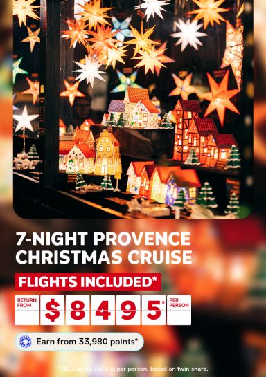 Star lanterns and small village displays at a Provence Christmas market for a 7 night cruise with flights included from $8495 per person