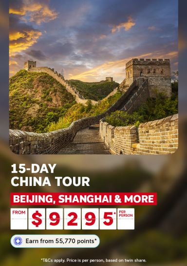 Great Wall of China winding across misty hills at sunset for a 15-day China tour visiting Beijing Shanghai and more from 9295 per person