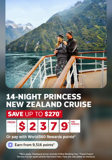 Couple admiring misty green mountains from a cruise deck for a 14-night Princess New Zealand cruise saving up to 270 from 2379 per person