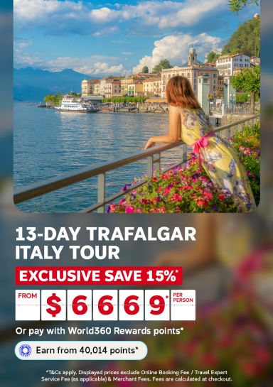oman in a flowing dress overlooking Lake Como's Bellagio waterfront for a 13-day Trafalgar Italy tour saving an exclusive 15% from 6669 per person