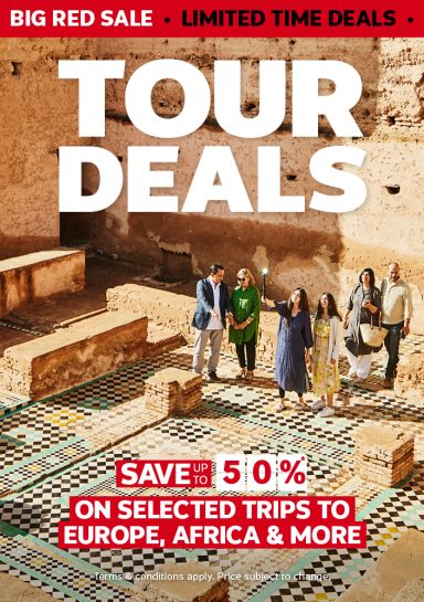 Big Red Sale - limited time deals | tour deals - save up to 50%* on selected trips to Europe, Africa & more *Terms & conditions apply. Price is subject to change | Tour group walking through ruins in a desert