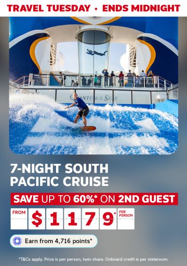 Man surfing an onboard wave pool aboard a cruise ship for a Travel Tuesday 7-night South Pacific cruise saving up to 60% on second guest from $1179