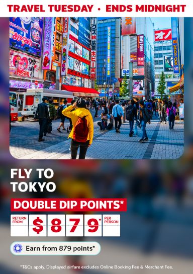 Busy, colourful street in Akihabara, Japan featuring return flights to Tokyo from $879