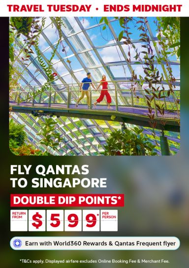 Couple walking through a dome in Gardens by the Bay in Singapore, featuring Qantas flights to Singapore return from $599* per person