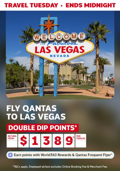 Las Vegas welcome sign on a sunny day featuring return Qantas flights to Las Vegas from $1,389