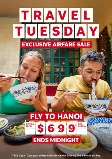 Travel Tuesday - exclusive airfare sale | fly to Hanoi - return from $699* per person | ends midnight | two people eating noodles | *T&Cs apply. Displayed airfare excludes Online Booking Fee & Merchant Fee.