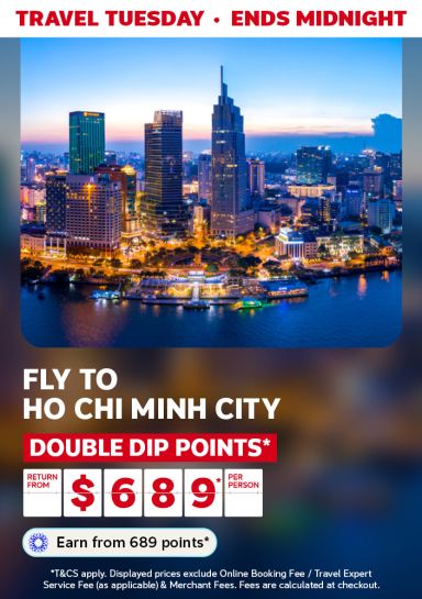 Ho Chi Minh City in the early evening featuring return flights from $689