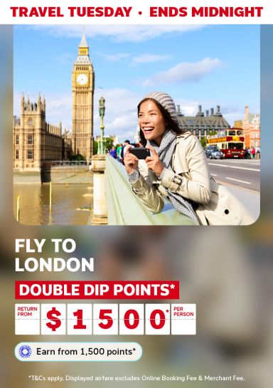 Woman smiling taking photos with Big Ben in the background featuring fly to London return from $1500* per person