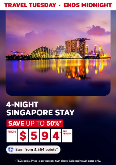 Gardens by the bay in Singapore lit by purple lights featuring a 4-night Singapore stay from $594
