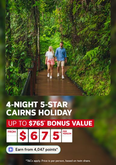 Couple walking hand in hand along a rainforest boardwalk for a 4-night 5-star Cairns holiday with up to $765 bonus value from $675 per person