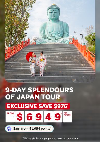 9-day splendours of Japan tour | exclusive save $976* - from $6,949* per person | Earn from 41,694* points | *T&Cs apply. Price is per person, based on twin share | Two women in kimonos walking down stairs with the large Buddha of Kamakura Japan in the background