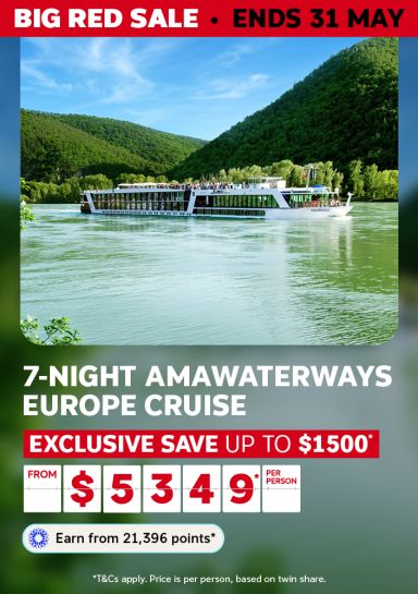 AmaWaterways ship gliding through a lush green European river valley for a Big Red Sale 7-night Europe cruise saving up to $1500 from $5349 per person