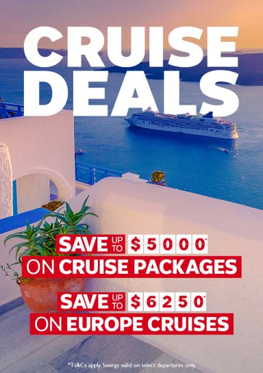 Cruise ship passing whitewashed Santorini buildings at sunset for Flight Centre Cruise Deals saving up to $5000 on packages and $6250 on Europe cruises