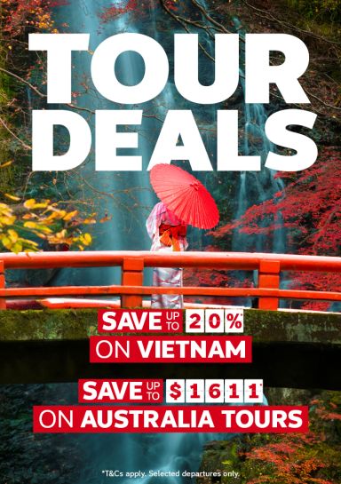 Person holding a red parasol on a red bridge looking at a waterfall featuring Tour Deals like save up to 20% on Vietnam and save up to $1611 on Australia tours