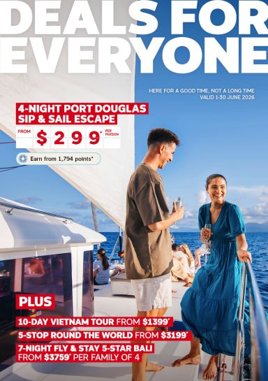 Couple enjoying drinks on a yacht at sea featuring a 4 night Port Douglas Sip and Sail Escape from $299 plus tours and Bali stays