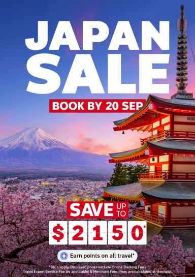 Snow capped Mount Fuji and a red pagoda above cherry blossoms and city lights for a Japan sale saving up to 2150 dollars