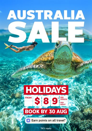 Snorkeller swimming alongside a turtle underwater for the Australia Sale with holidays from $89 per person per night book by 30 Aug
