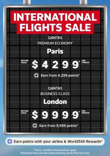 Airport departure board featuring an International Flights Sale with Paris Premium Economy from $4299 and London Business Class from $9999