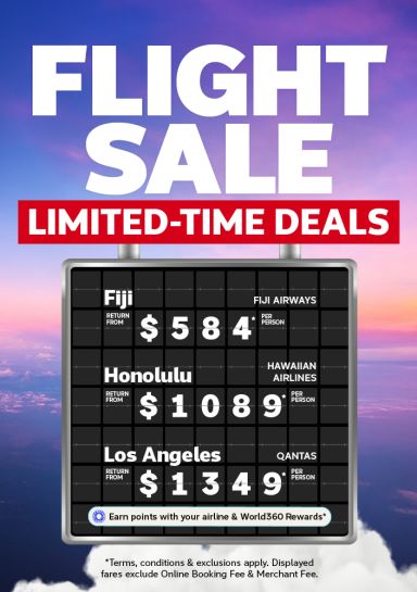 Airport departure board featuring limited time return flights to Fiji from $584, Honolulu from $1,089 and Los Angeles from $1,349