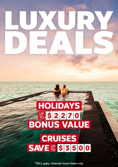 Couple relaxing in an infinity pool at sunset for luxury deals with holidays up to 2270 bonus value and cruises saving up to 3500