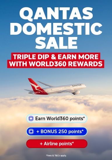 Qantas plane flying through clouds featuring a Qantas domestic sale with bonus World 360 Rewards points