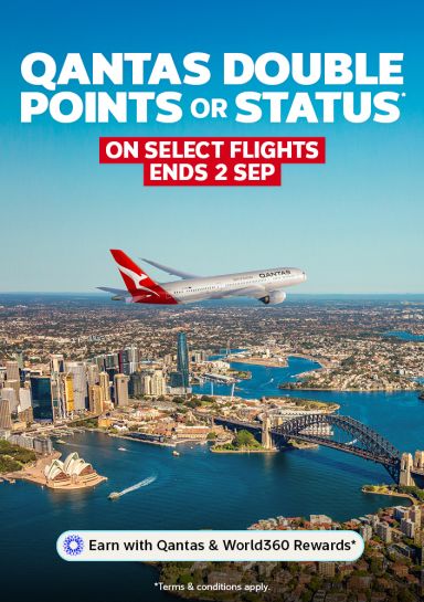 Qantas aircraft climbing over city skyline for double points or status on select flights ending 2 September