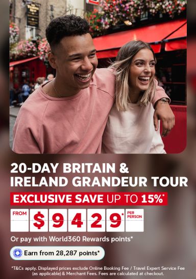 Couple laughing on a colourful Dublin street for a 20 day Britain and Ireland Grandeur Tour saving up to 15 percent from 9429 per person
