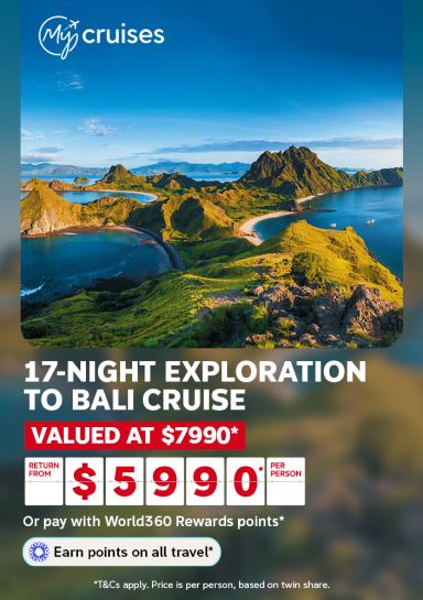 Aerial view of rugged green hills bordering calm Bali bay waters for a 17-night exploration cruise valued at $7990 from $5990 per person