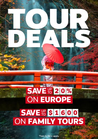 Person in a kimono with a red parasol on a red bridge before autumn waterfalls for tour deals saving 20 percent on Europe and 1600 on family tours